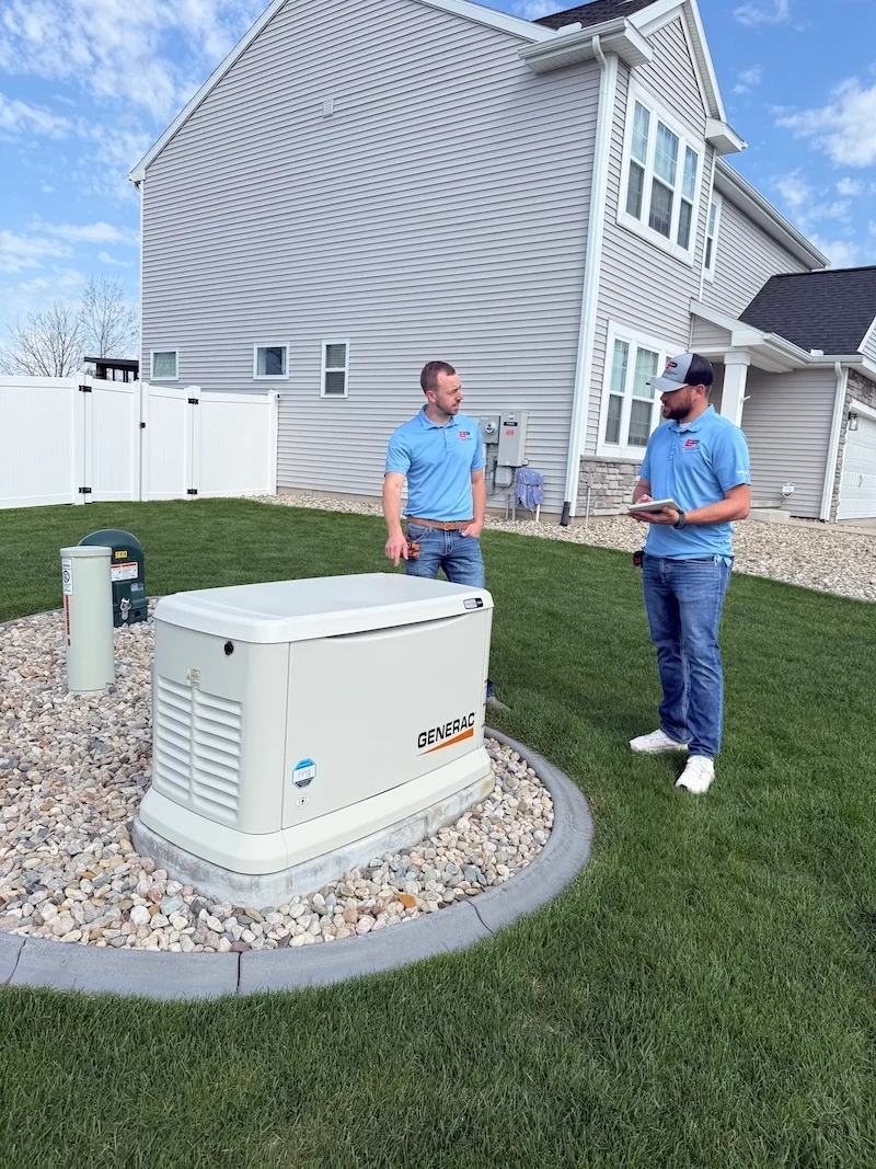 Elevated Power crew installing a standby generator